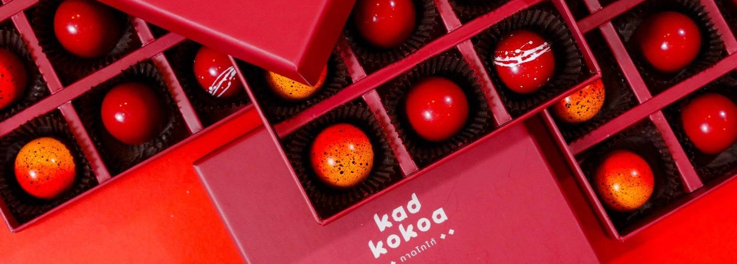 Red chocolate box with 'kad kokoa' branding on a red background